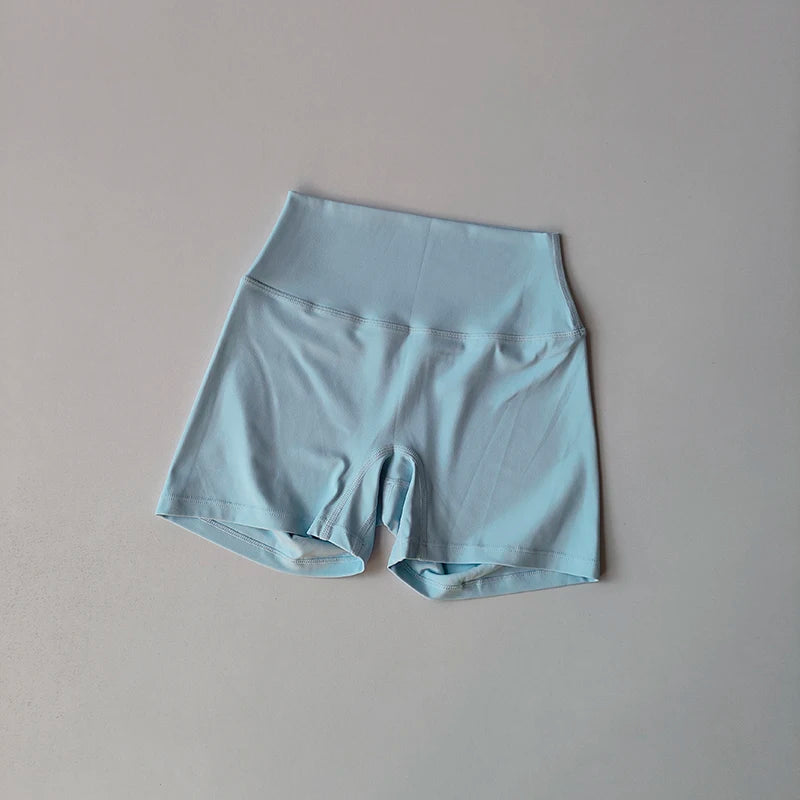 Conjunto Halter Seamless Atravex™ con Shorts Cintura Alta Acanalados – Definición y Soporte en Movimiento